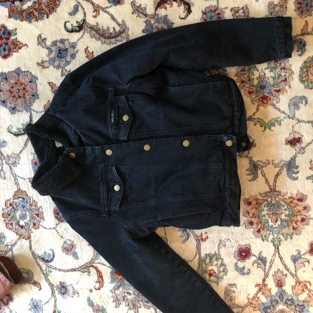 Faux shearling lined denim trucker jacket
